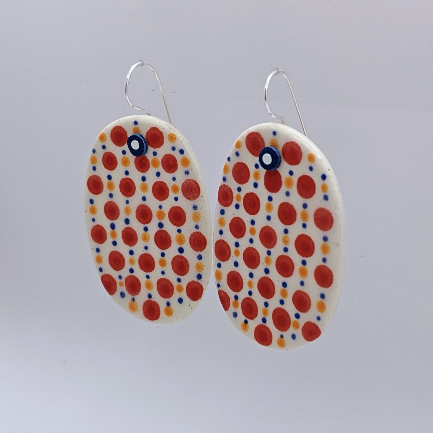 Here and Here: Red Dotted Ceramic Disc Earrings Product Image 3 of 3