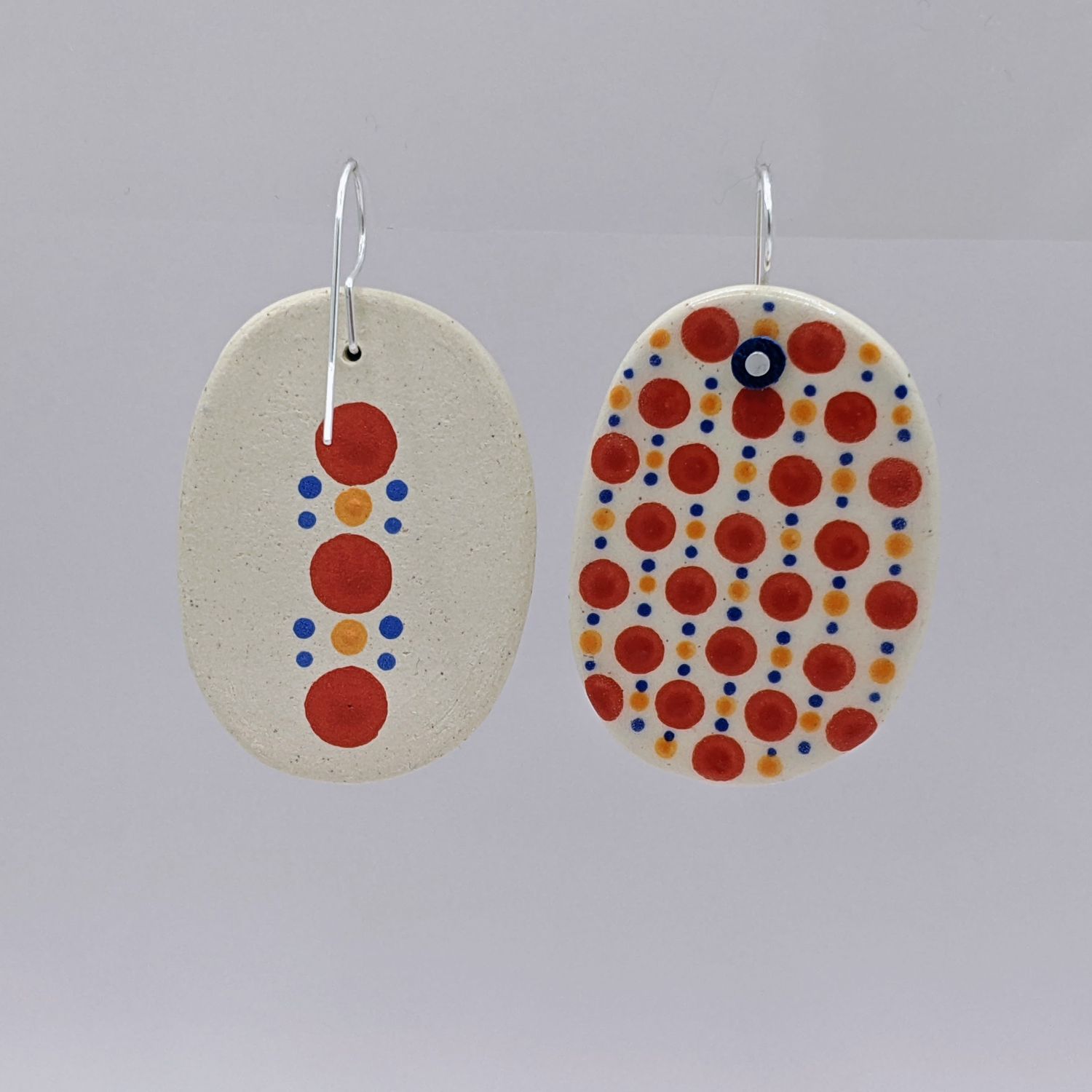 Here and Here: Red Dotted Ceramic Disc Earrings Product Image 2 of 3