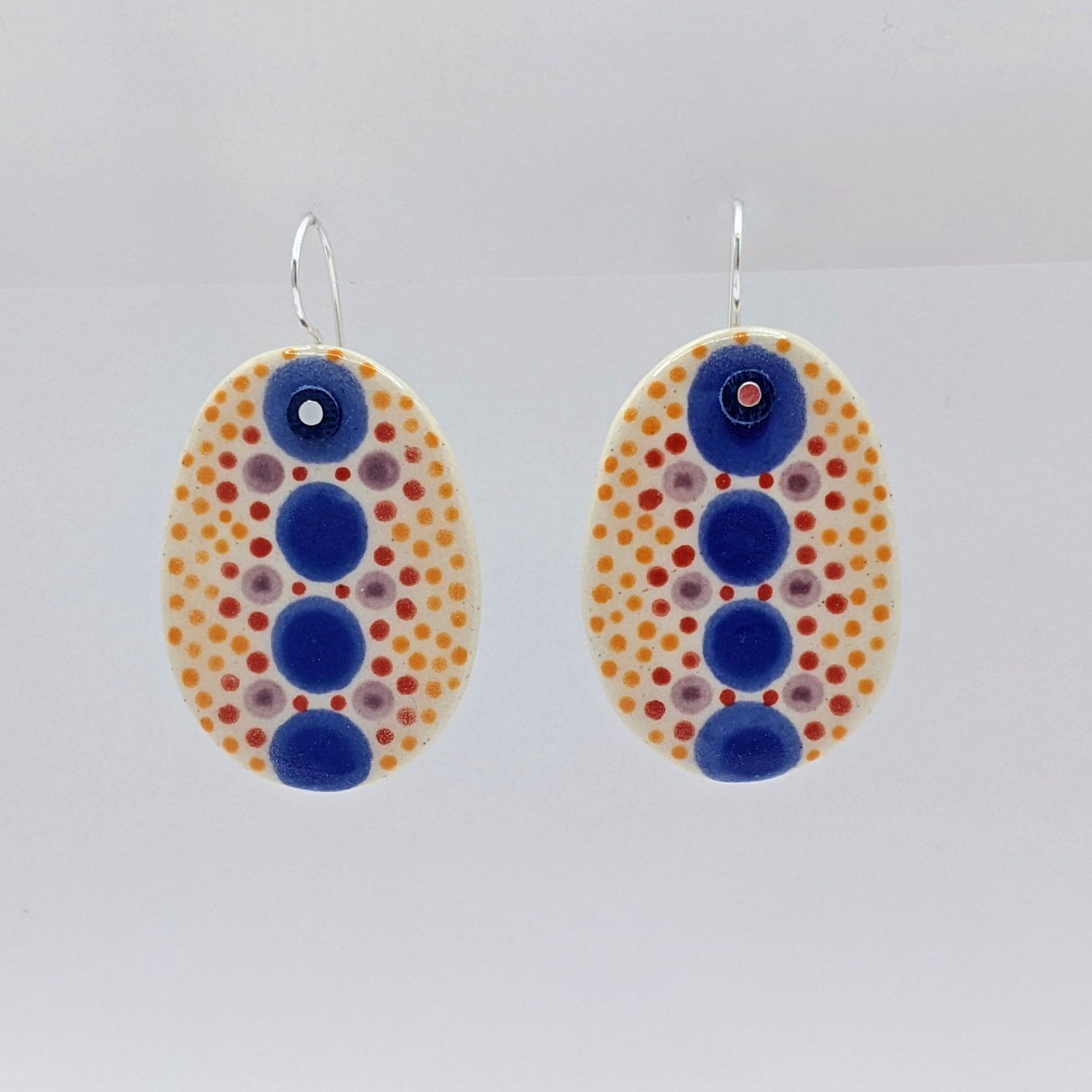 Here and Here: Blue and Multi-Coloured Dotted Ceramic Disc Earrings Product Image 1 of 2