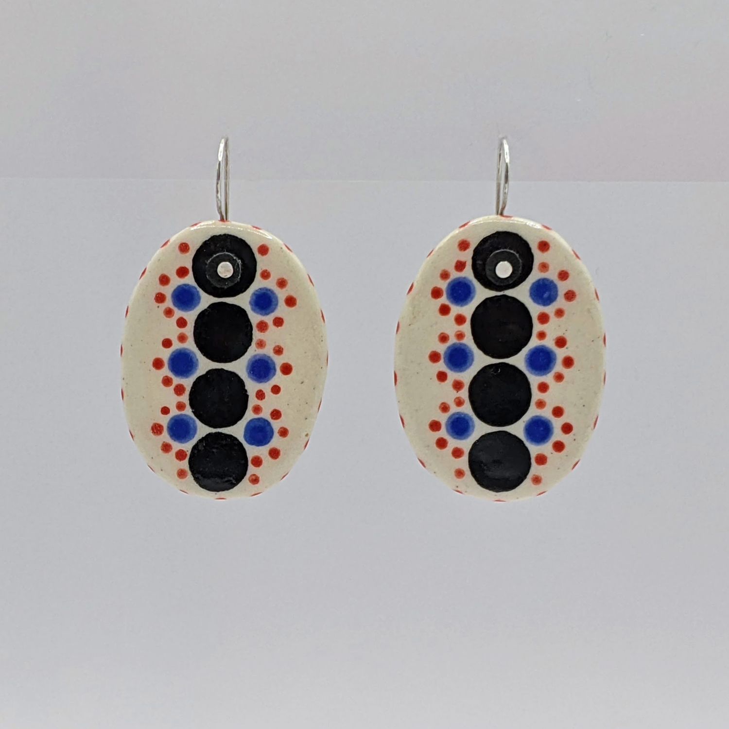 Here and Here: Black and Multi-Coloured Dotted Ceramic Disc Earrings Product Image 1 of 3