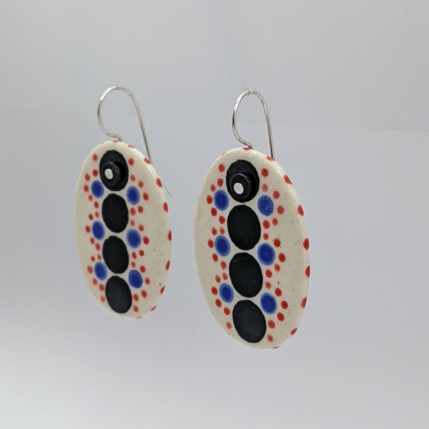 Here and Here: Black and Multi-Coloured Dotted Ceramic Disc Earrings Product Image 3 of 3