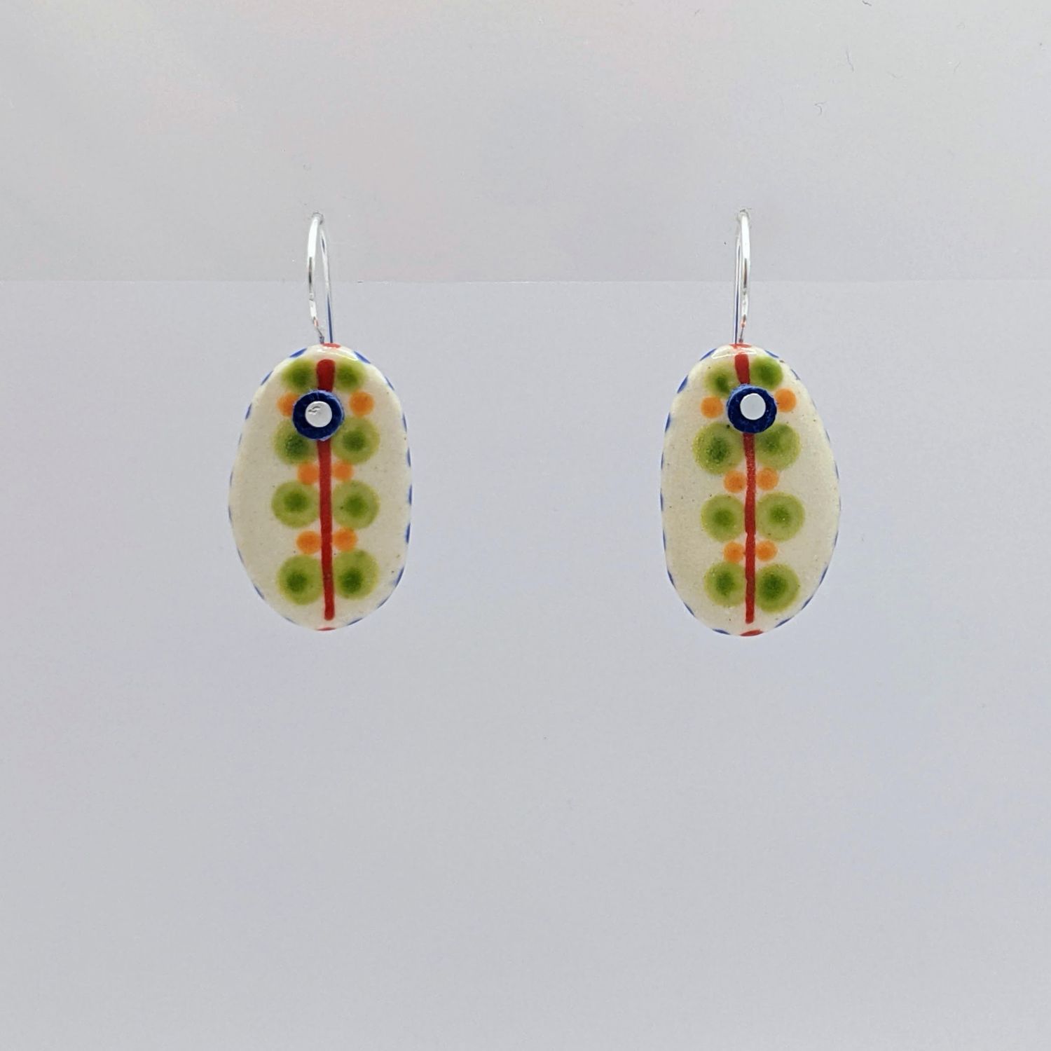Here and Here: Green Dotted Ceramic Disc Earrings Product Image 2 of 4