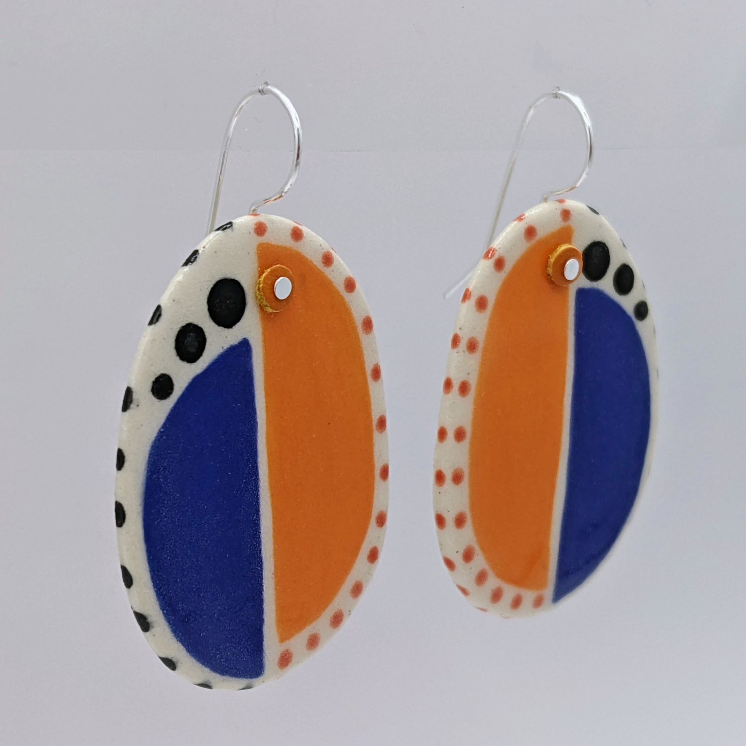 Here and Here: Half Blue and Half Orange Ceramic Disc Earrings Product Image 4 of 4