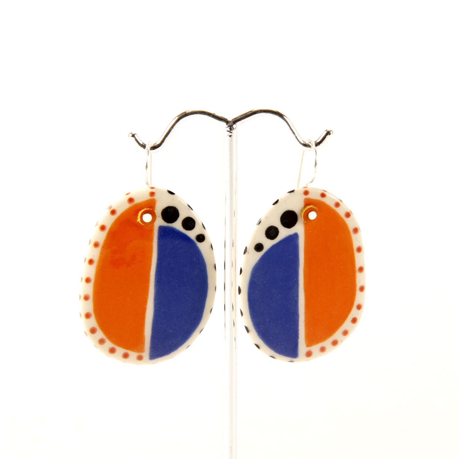 Here and Here: Half Blue and Half Orange Ceramic Disc Earrings Product Image 1 of 4