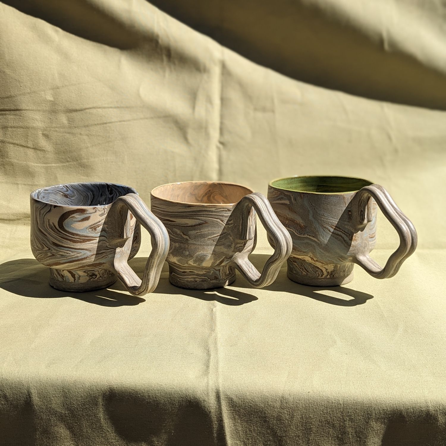 We Nichol: Blue-grey Wavy Handle Mug with Green Interior Glaze (Each sold separately) Product Image 1 of 1