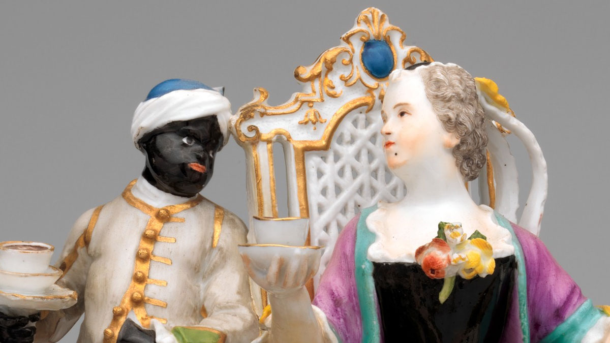 Porcelain sculpture with a white woman being attended by a Black servant