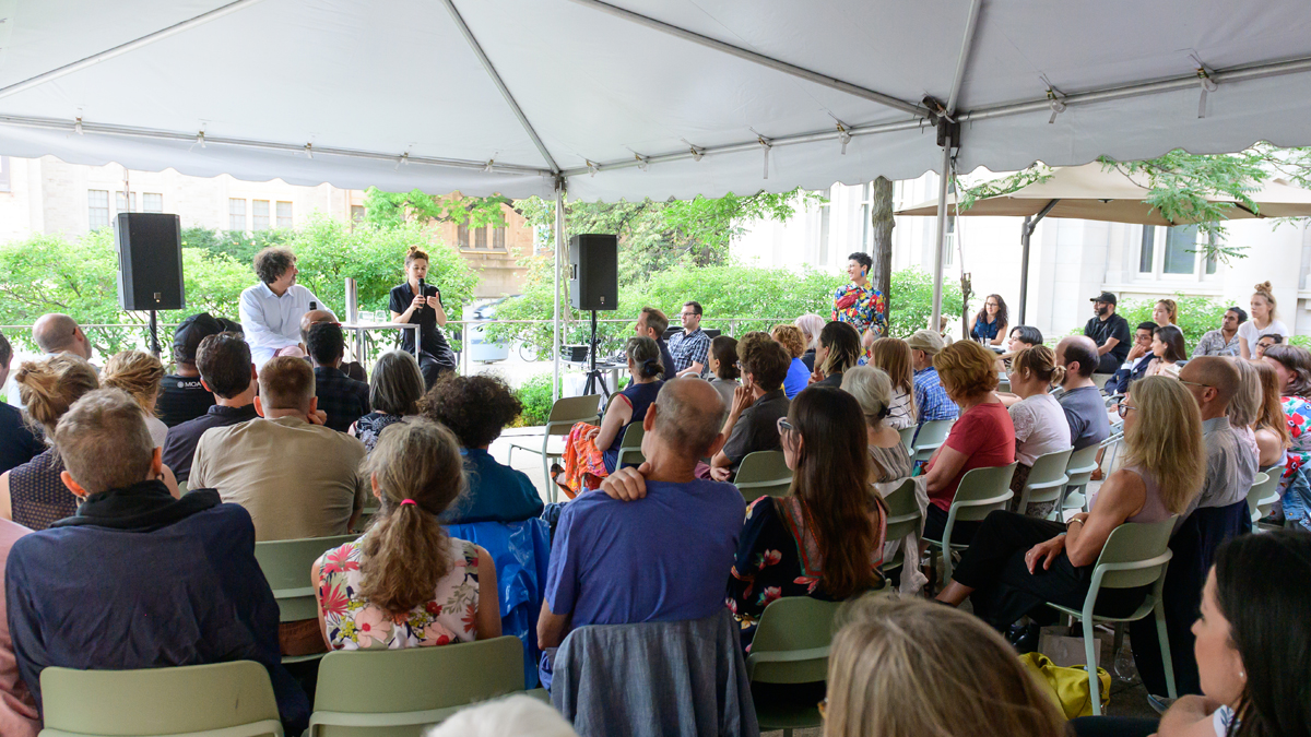 Hrag Vartanian and Shary Boyle speaking in front of a crowd on the Gardiner Plaza