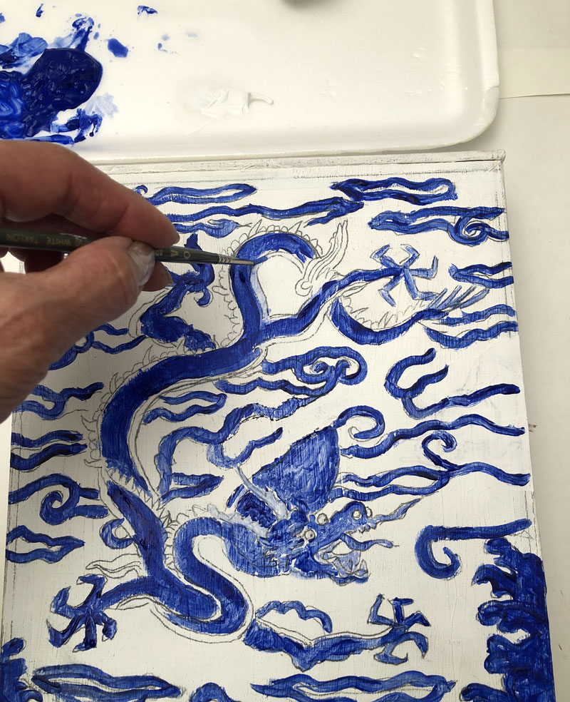 Painting a dragon design blue