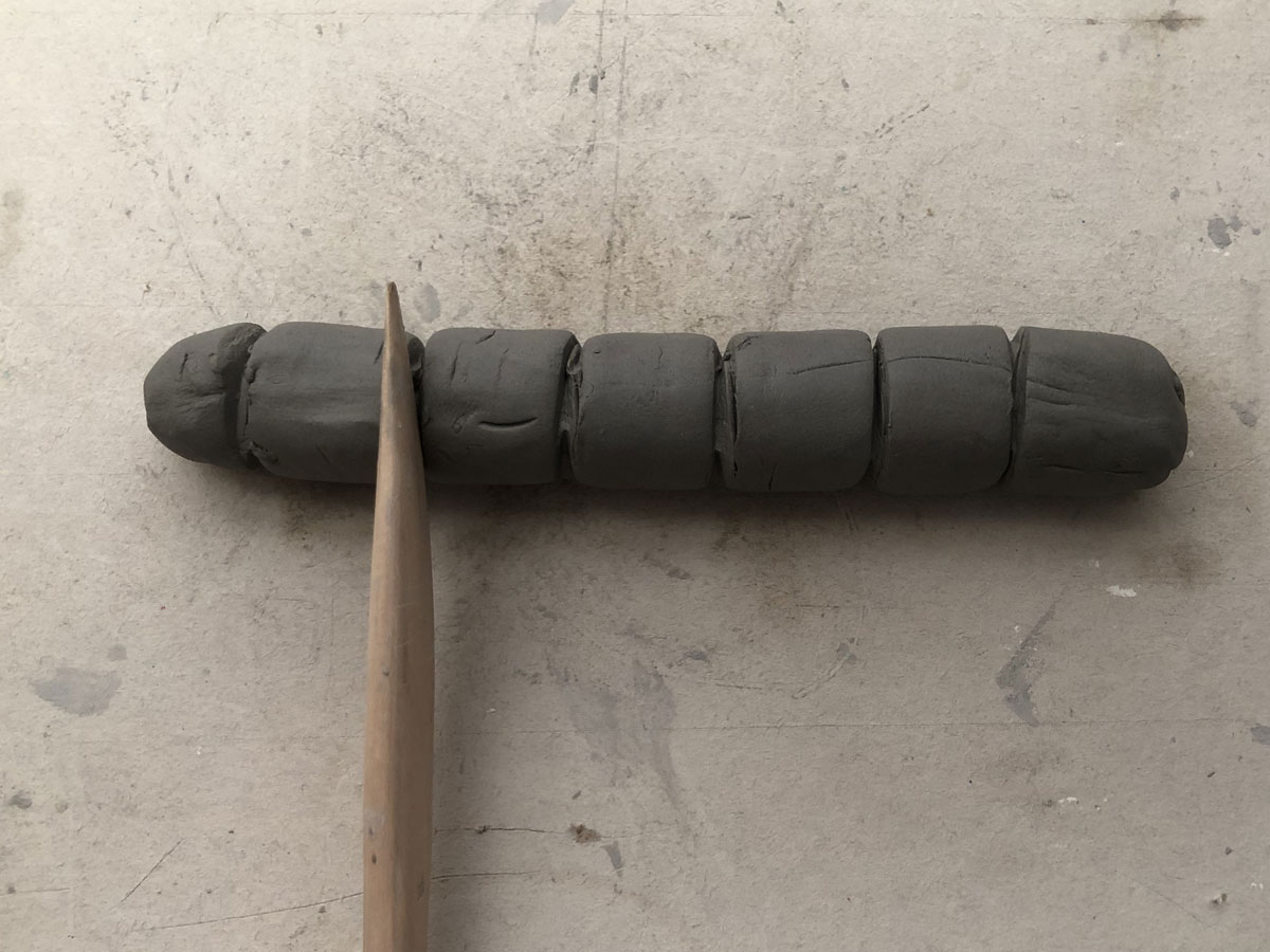 Piece of clay rolled out with lines in it