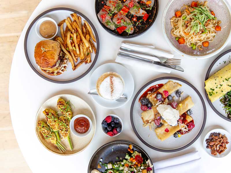 Plates of food on a table seen from overhead