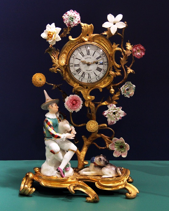 Clock with Harlequin Playing Bagpipes and Pug Dog, Germany, Meissen Porcelain Manufactory, c.1745-1752; Modelled by Johann Joachim Kaendler, Hard-paste porcelain with overglaze enamels, French orm