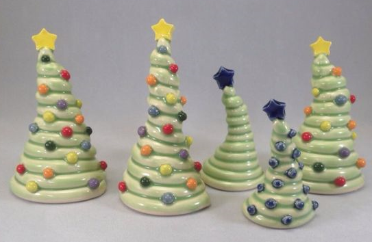 Four coiled Christmas trees