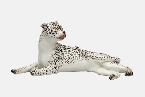 Porcelain figure of a leopard reclining
