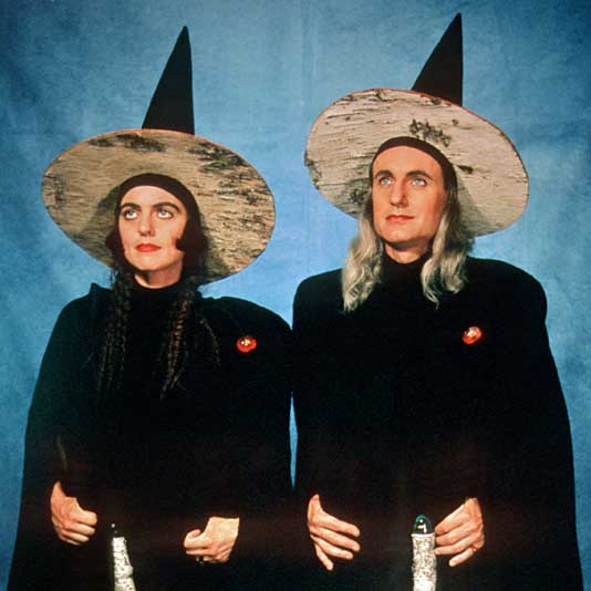 The artists FASTWURMS in black cloaks and pointy witch hats