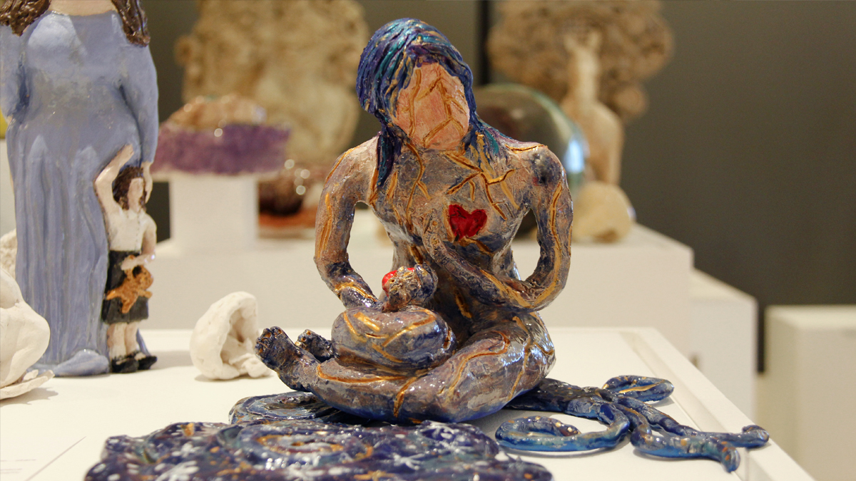 Ceramic sculpture of a seating woman