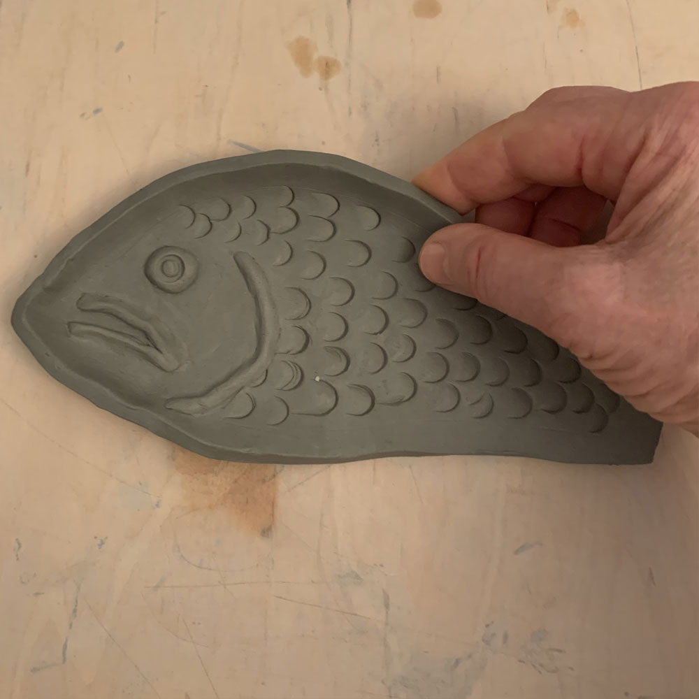Clay fish plate with scales