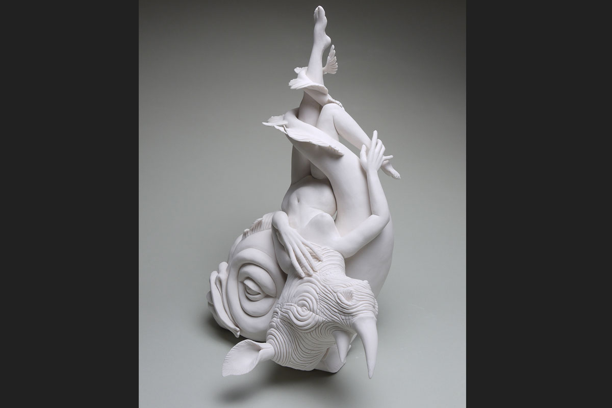 White ceramic sculpture of animals intertwined