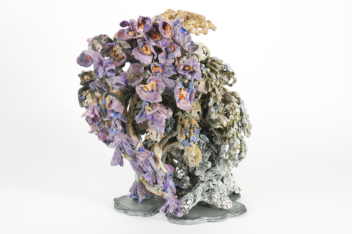 Abstract ceramic sculpture with purple and gold glaze