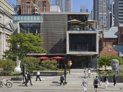 Exterior of the Gardiner Museum with people walking by