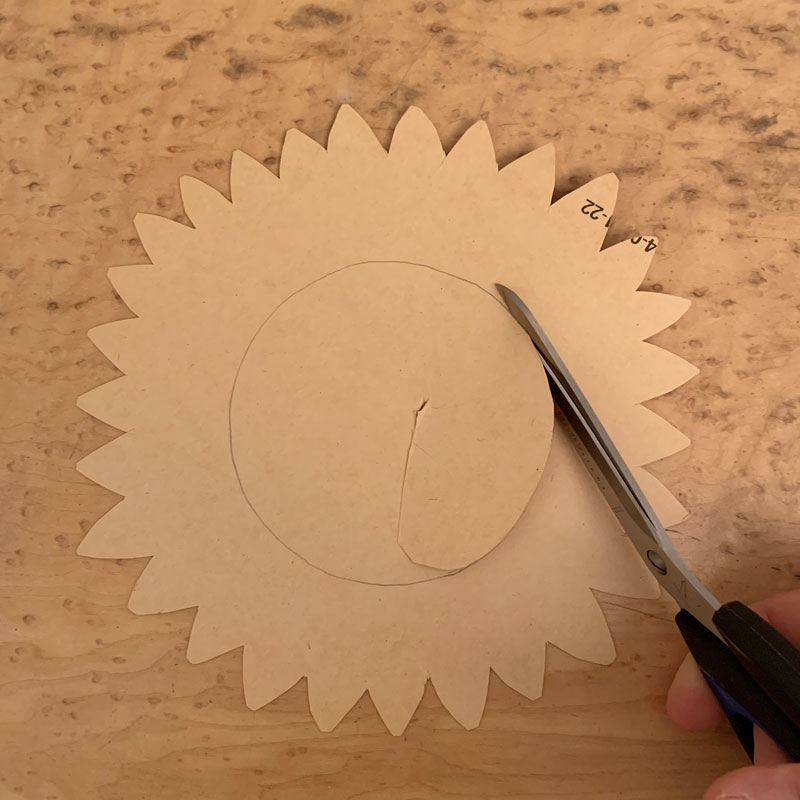 Cutting the centre out of a paper sunflower