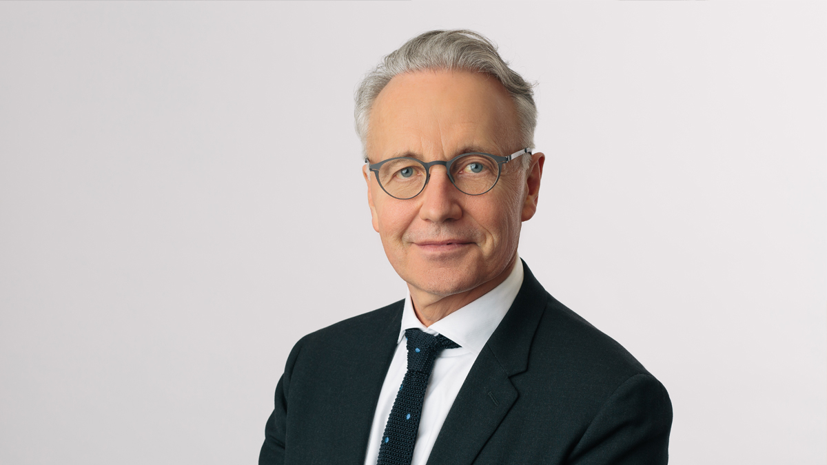 Photo of Kelvin Browne, Gardiner Museum Executive Director & CEO wearing a black suit jacket and tie with a white shirt