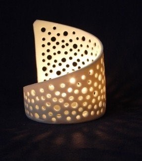 Perforated candle holder