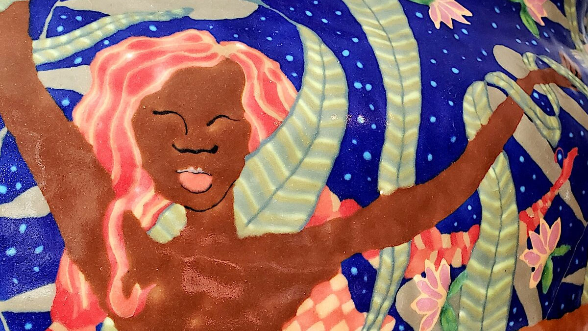 Detail of a ceramic vessel with a woman swimming