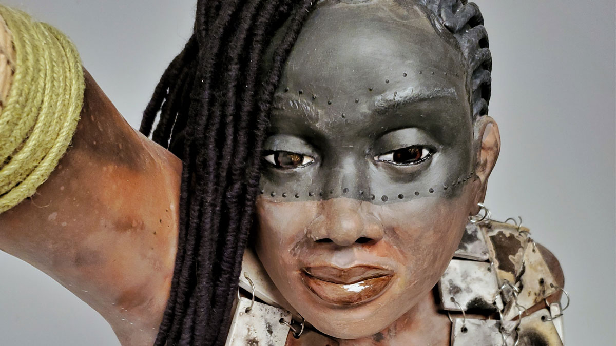 Ceramic bust of a warrior woman with braids