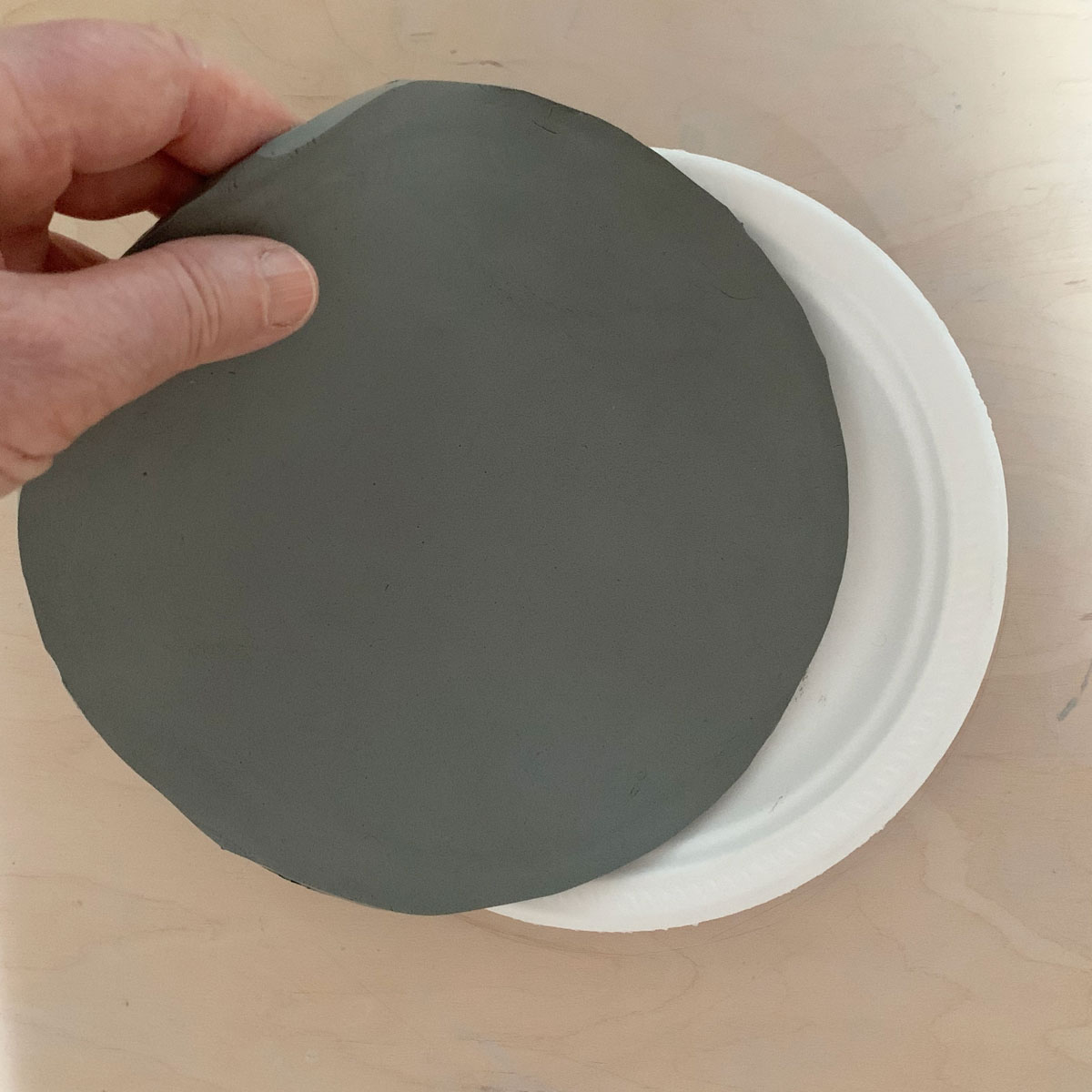 Round clay slab on a plate