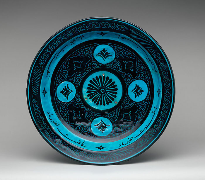 A black and turquoise dish from Iran