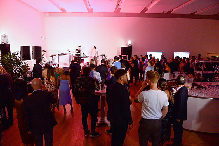 A crowd of partygoers at SMASH 2018 watching a performance by Langston Francis