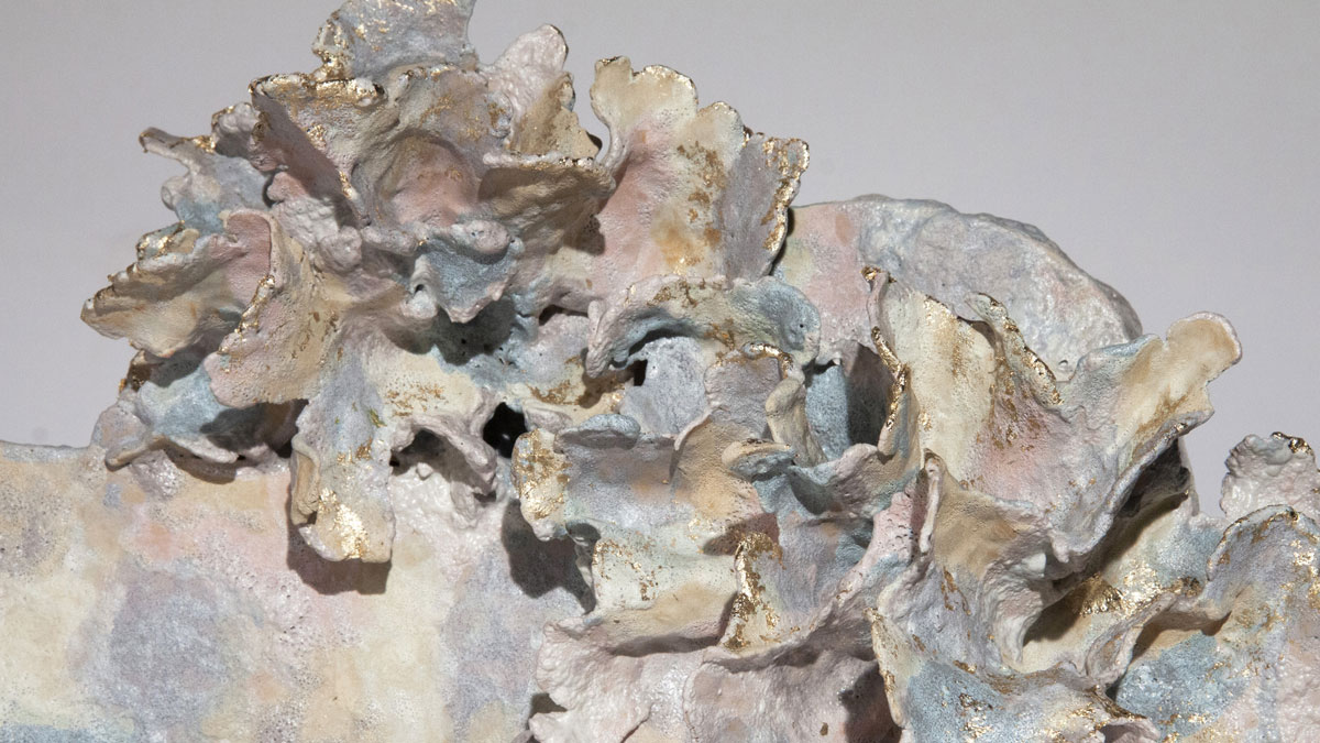 Detail of an abstract sculpture with pastel coloured glazes