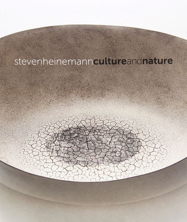 Exhibition catalogue with grey and white vessel with crackling and a black thumbprint