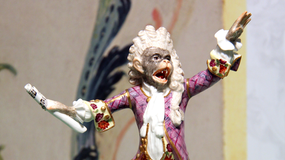 Meissen porcelain monkey dressed as a conductor with a white powered wig