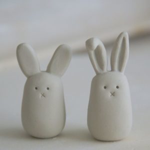 Two clay rabbits