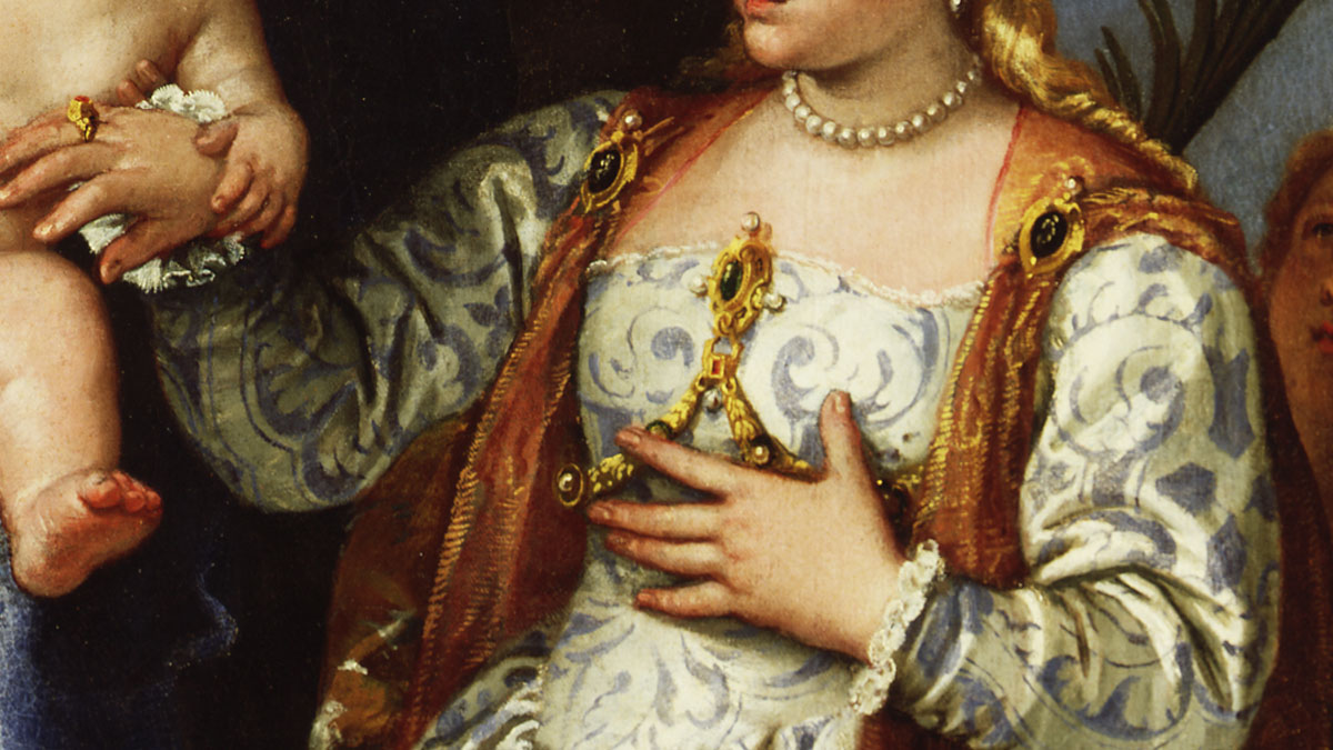 Detail of a painting with a Renaissance woman in an ornate dress with jewellery