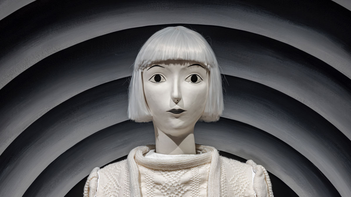 White sculpture with a white bob hair cut from the shoulders up