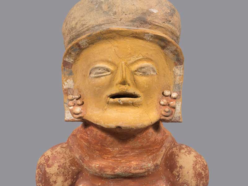 A female effigy gigure holding a small figure